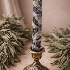Black candle with sage