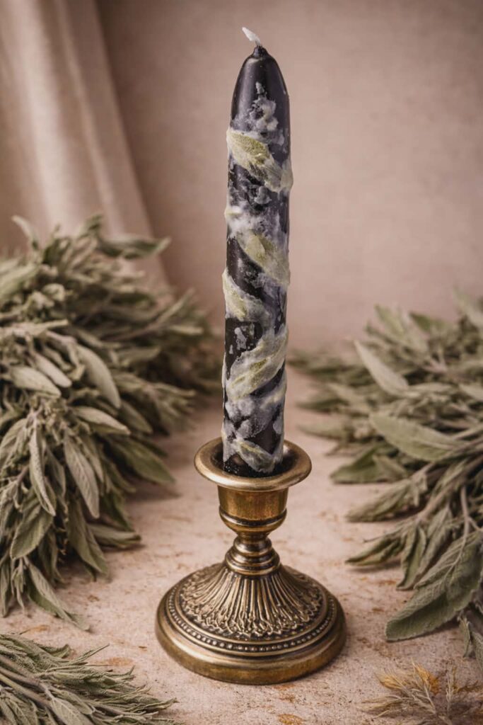 Black candle with sage