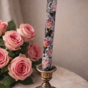 Black candle with roses